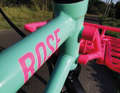 The Rose lettering and the large front strap in bright pink attract attention.