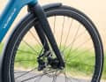 Despite its powerful motor and 600 watt-hours, the Velo de Ville weighs just 21 kilos. This is partly thanks to its sleek carbon fork.