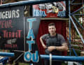 Richard Gasprotti in front of the Wall of Death. The fairground attraction is operated by the French circus troupe Mur De La Mort.