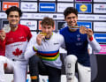 Bite into the gold medal. Yes, the precious metal is real.
