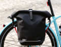 Both have a universal mount that should fit most common luggage carriers.
