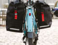 Zéfal hangs his two new panniers on his bike...