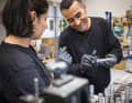 Employees assemble the drives with dexterity