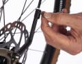 Topeak uses rigid square aluminium struts, the length of which is infinitely adjustable using a quick release.