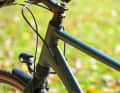 The frame tubes are individually moulded. A fork suspension is located under the head tube.