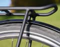 The retaining screw of the carrier and plate almost touches the tyre.