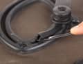 Protective elements for the lower hooks are pressed into the guide in which the locking hook sits.