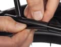 Abrasion protection: slotted plastic sleeves under the bag hooks prevent abrasion on the luggage carrier.
