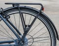 The pannier rack is far back and only fixed to the frame with a simple underrun strut. This is not very torsionally rigid.