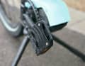 The pedals on the Moca are foldable. This allows the bike to be stored as compactly as possible when the handlebars are folded.