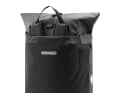 The flap can be folded over from one side to the other and protects the shoulder straps ...
