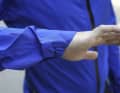 The sleeves are cut long and the cuff covers the wrists even when stretched out