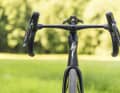 The head tube appears slimmer when viewed from the front, and the fork legs are positioned slightly further away from the tyre