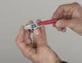 3. slide a pad of the same shape and sufficient thickness as the rim type into the carrier. It is best to secure the pad with a new screw that has already been fitted with threadlocker.