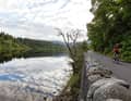 Mirror image: A winding road leads through the fairytale forest of the Trossachs, including views of the lake and sky, as here at Loch Achray.