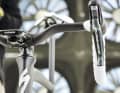 Clean front: Horizontal stem, naked fork and offset handlebars without visible cables characterise the bike's appearance