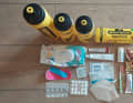 Wet wipes, kinesiotape, disinfectant wipes, rapid corona test, FFP2 mask, sun cream, toothbrush, toothpaste, bars, nutritional supplements, 2 bottles 0.75 litres, 1 bottle 1 litre, water treatment tablets, stomach tablets, salt tablets, caffeine tablets, chamois cream