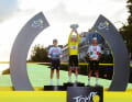 The winners’ podium at the 2026 Tour de France, featuring Evenepoel, Pogacar and Del Toro (from left)