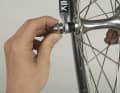 1. on the front wheel, you then need to loosen the nut on the other side a few turns so that the quick-release can slide past the fork's safety catches.