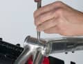 5. clamp the frame in a mounting stand or clamp it to the seat post if it is deep enough in the frame. Or ask someone to hold the frame briefly. Centre punch the drilling point to prevent the drill bit from slipping.