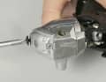 3 For nine-way handles, you can replace more by loosening the central screw connection at the front and removing the screw and washer.