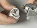 4 You can then remove the entire plastic front section. Pay attention to the small parts underneath so that you have their order ready when reassembling later.