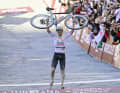 After the Slovenian crossed the finish line well ahead of the competition, he raised his bike high into the air.