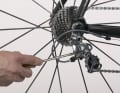4. limit the travel of the rear derailleur with the second end stop screw until the chain runs reliably on the largest sprocket. Continue turning the crank and release the rear derailleur so that the chain runs on the smallest sprocket again.