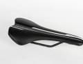 Pro Griffon 142 mm
	Pressure peaks were noticeable in both upright, comfortable and racing positions; in the perineal area you can feel the edges of the long channel, especially in the stretched position; the saddle cover is a tad too slippery and the adjustment range could be longer Price: 95 euros