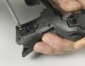 2. loosen the two Phillips screws on the inside of the handle and remove the plastic plate to the flight deck contacts.