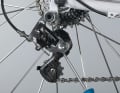 2 The guide roller touches the tooth tips in some positions. Turning the screw at the bottom can prevent this. This does not always work because Campa's rear derailleur does not harmonise with derailleur hangers that are far back.