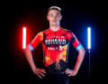 The basic colour remains red with yellow/orange geometric motifs and light blue trims on the arms and black elements