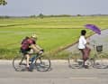 After the mountains, the fourth day takes TOUR author Dres Balmer through rice fields to the Mekong.