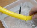 Searching for holes in the water bath: It doesn't always bubble as wildly as in our prepared defect. Low overpressure (max. 0.3 bar) makes it difficult to detect the smallest holes in TPU.