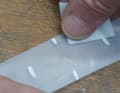 Mark the hole and degrease the repair area with alcohol. Do not roughen.  Allow the alcohol to evaporate completely.