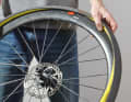 Check the tyre casing and the inside of the rim for damage and foreign objects. Then insert the lightly pumped inner tube all the way round into the casing that has already been fitted on one side.