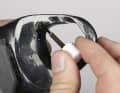 If the plastic material is not coloured through, you will need to repaint it. First try out a concealed area to see whether the paint is compatible with the plastic.
