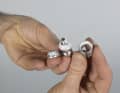 Disassemble the clamping cone to adjust the headset and apply a thin coat of paint to the surfaces that slide against each other on the inside and to the screw.