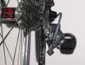 1. shift the chain to the smallest chainring or sprocket with the front derailleur and rear derailleur until no more click stops are triggered when shifting down. The shift cables are then completely slack. Look at the rear derailleur from behind. The guide roller of the rear derailleur must be positioned exactly under the smallest sprocket, the chain then forms a straight line. If this is not the case, you must adjust the position using the end stop screw.