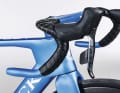 The short wrapped handlebar tape reveals the cockpit painted in the frame colour