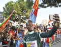 People's hero: Girmay is cheered by Eritrean compatriots at the finish line of the Tour de France