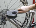 Once the cleaner has worked in, remove the remaining dirt with a large brush with long, soft bristles