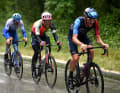Bais falls back on the descent from the Passo delle Radici. Three riders remain at the front