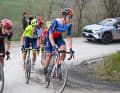 For almost 75 kilometres at the start of the race, a five-man lead group was at the front, including Lawson Craddock from Team Jayco-AlUla (right)...
