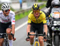 Isaac del Toro (left) and Sepp Kuss (right) then split off and rode two abreast, but they too were swallowed up early on