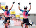 Team Canyon//SRAM Racing celebrates a double victory on stage 3 of the 2024 Women's Tour de Suisse with Neve Bradbury (right) and Kasia Niewiadoma (left)
