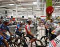 At the supermarket checkouts, the riders get ready for the 185.5 kilometres between Jerez de la Frontera and Yunquera