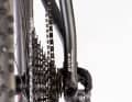 The asymmetrical rear triangle requires special rear wheels, but the chainline is borderline on the outermost sprockets