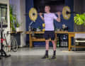 For the squat, the barbell rests on the neck, upper trapezius muscle and shoulders