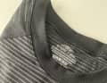 The base layer from Aldi is particularly unobtrusive with its stripes.